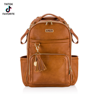 Brown leather diaper bag backpack with a tassel 
