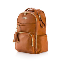 Brown leather backpack with gold accents on a white background