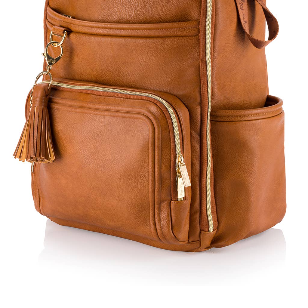 Brown leather backpack with gold zipper and tassel on a white background